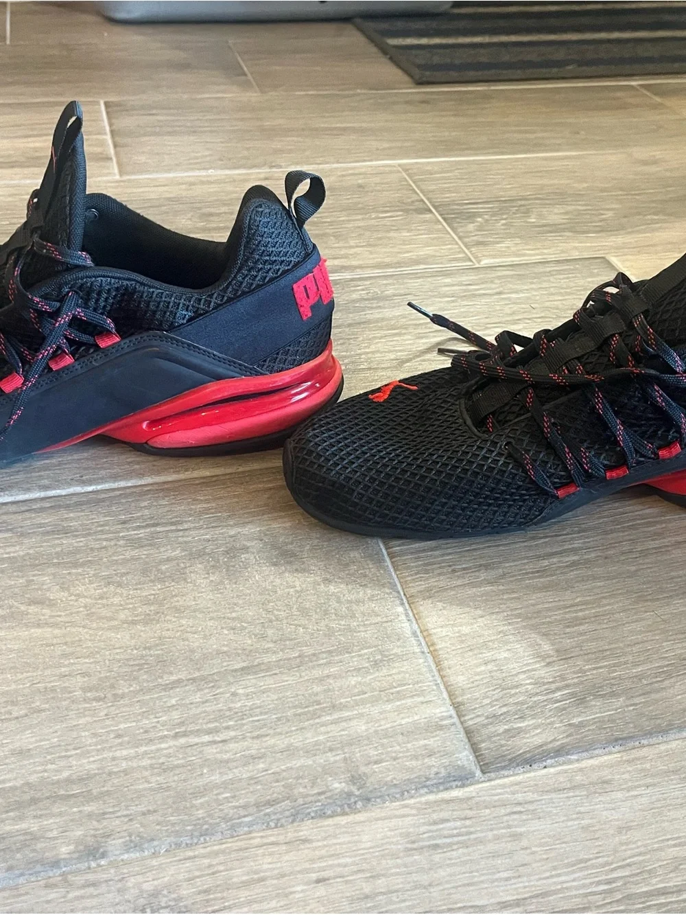 Puma Black Sneakers with Red Accent Logos